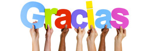 Multiethnic Group of Hands Holding Gracias